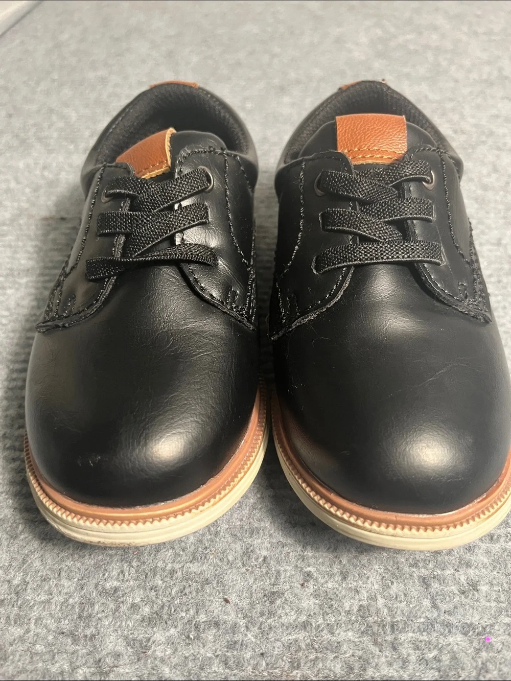 Black Oxford Lace-Up Shoes with Tan Accents. Small scuff mark on toe bed.